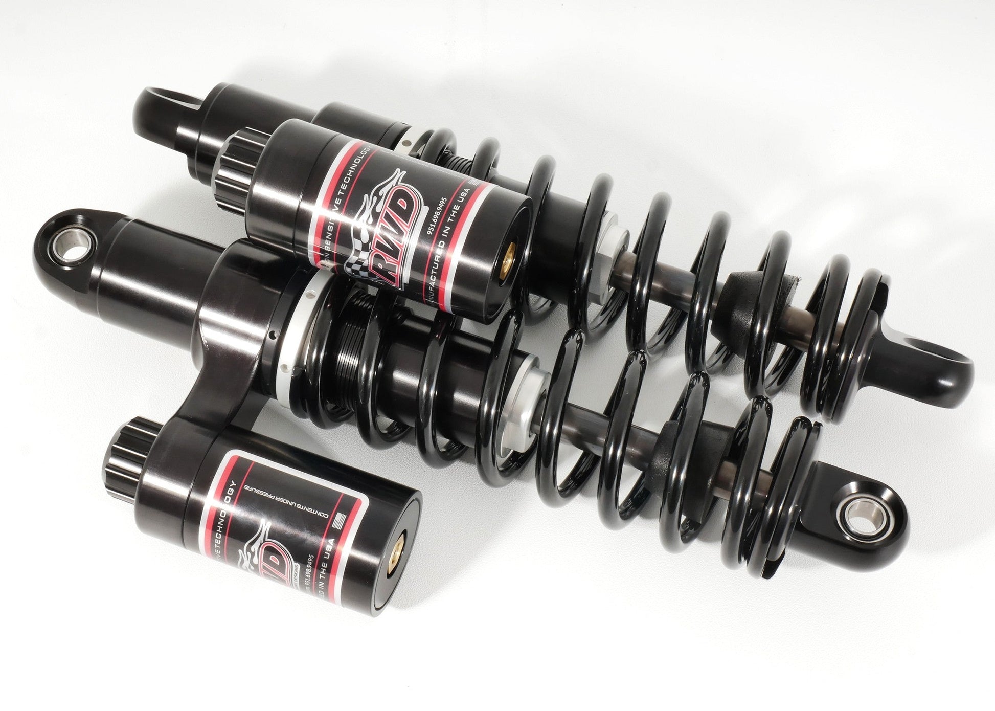 RWD V-Twin Harley suspension parts shown on a white background