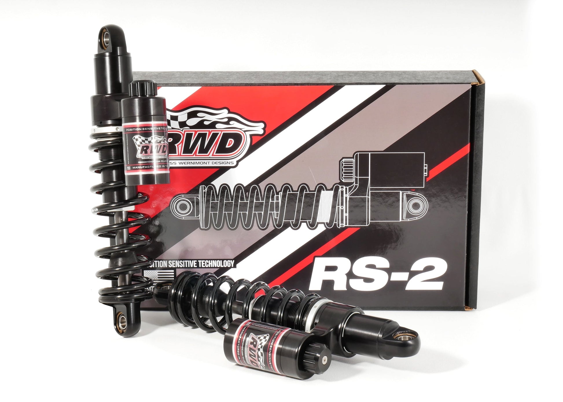 RWD V-Twin RS-2 Dyna shocks, featuring two black shock absorbers and two smaller black reservoirs, displayed in front of their product box.