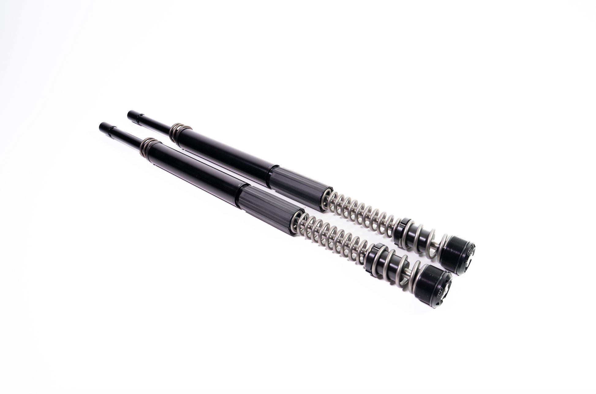 Two RWD V-Twin black motorcycle fork cartridges with exposed springs, designed for enhanced suspension performance.